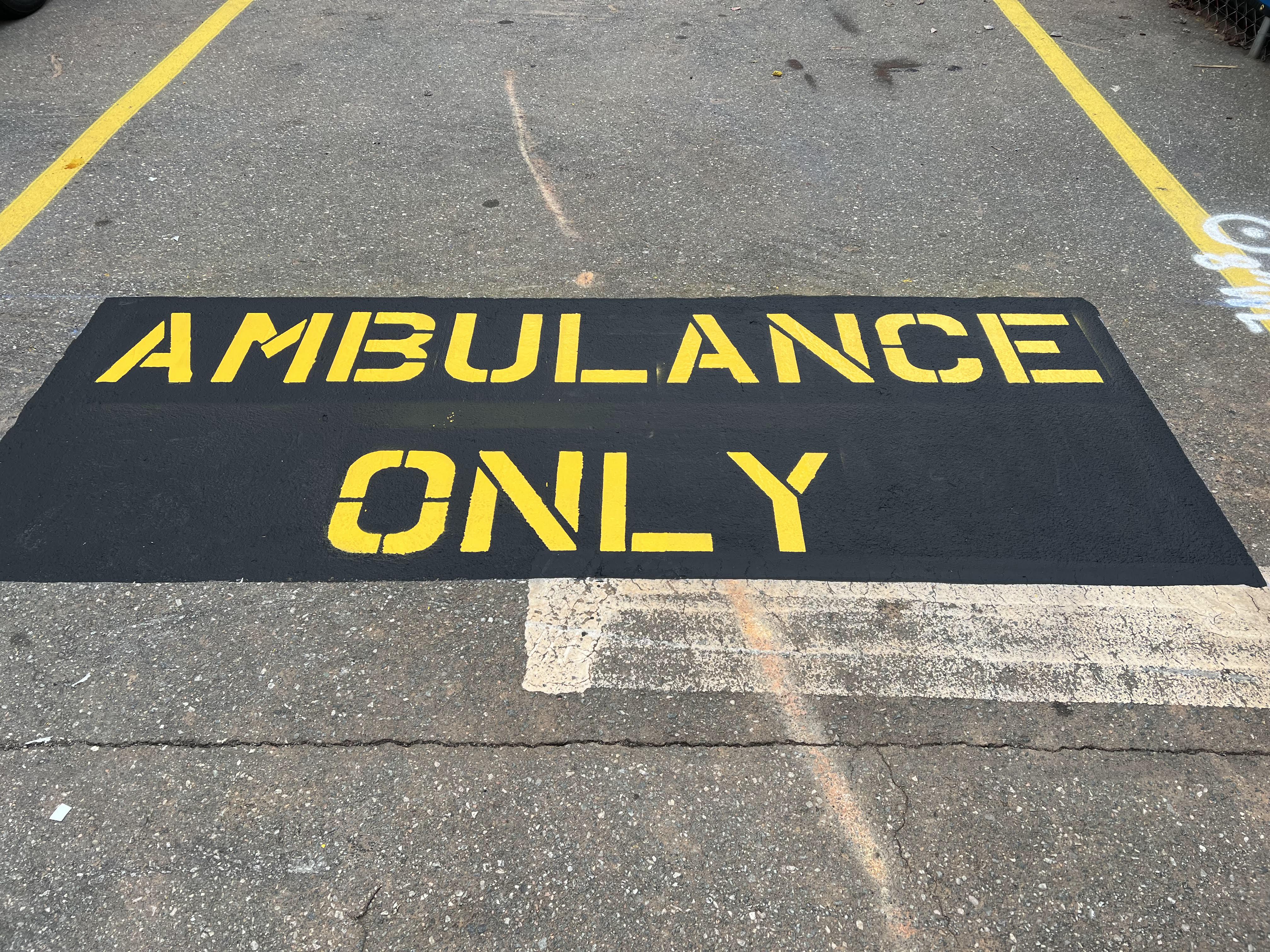 Ambulance Only line striping words